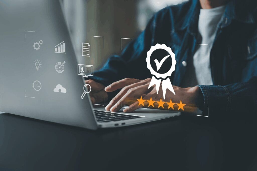 Person typing on laptop with digital icons.