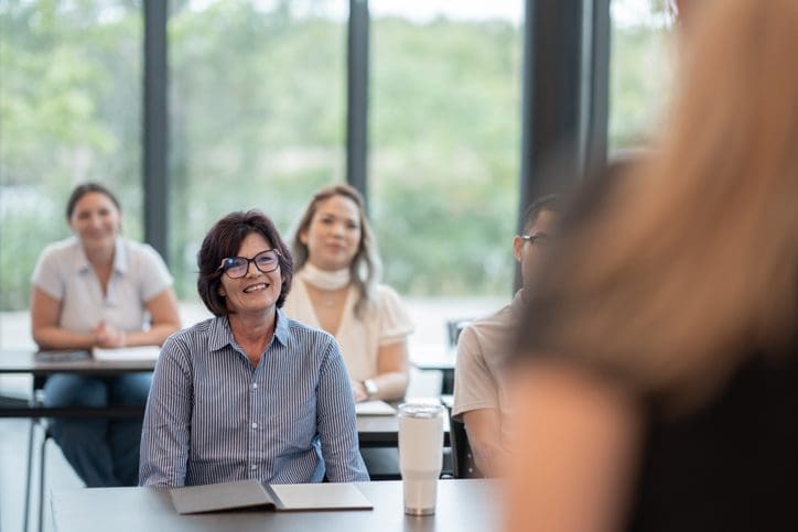 Audience attentively listening during a seminar or presentation.